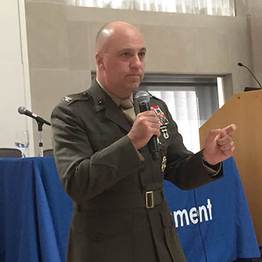 USMC Col. Gregory Breazile addressing the audience of the Digital Government Institute's Cyber Security Conference & Expo at the Ronald Reagan Building in Washington, D.C.