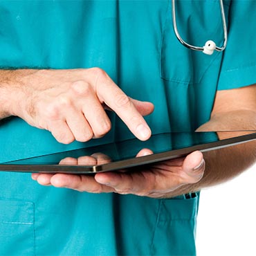 Shutterstock image: medical professional interacting with a handheld, tablet computer.