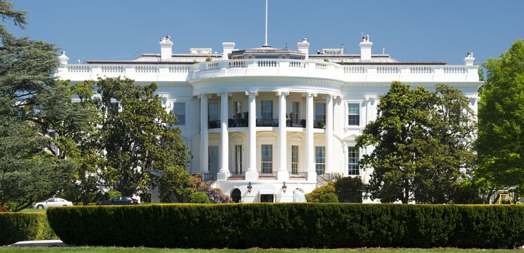 shutterstock ID: 147037244  White House on deep blue sky background  By Andrea Izzotti