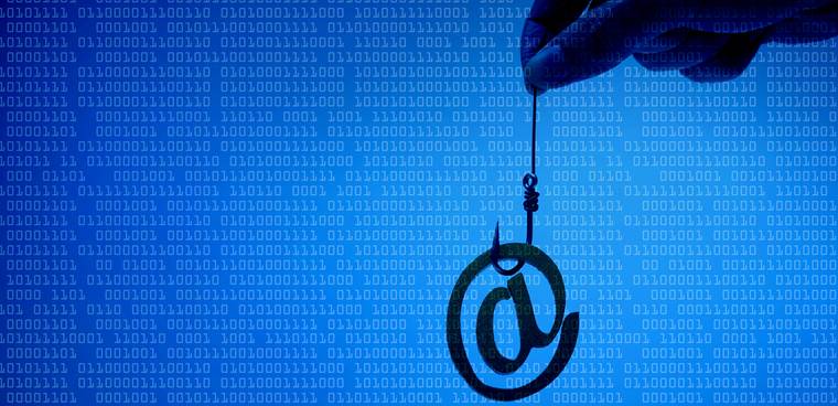 Email sign with a fish hook on blue digital background. Email security and countermeasure concept By wk1003mike shutterstock ID: 593626601