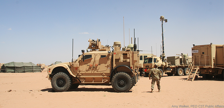 A soldier inspects a mobile Warfighter Information Network – Tactical (WIN-T) network node. (Photo by Amy Walker, PEO C3T Public Affairs)