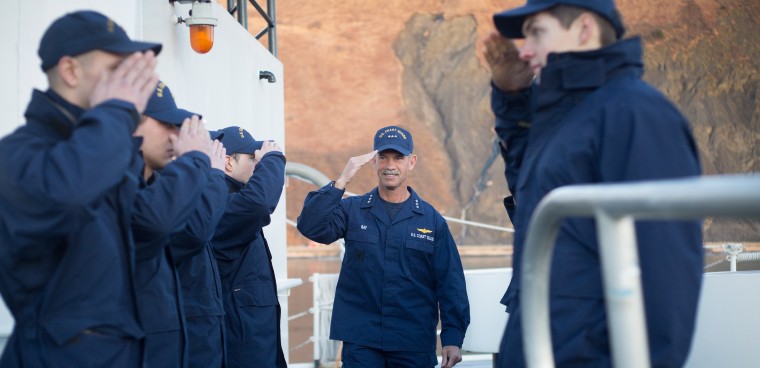 Crew members aboard Coast Guard Cutter Alex Haley salute as Pacific Area Commander Vice Adm. Charles Ray visits in Kodiak, Alaska, Feb. 18, 2015. Ray was given a tour and time to recognize a few shipmates before touring other units in Kodiak. (U.S. Coast Guard photo by Petty Officer 3rd Class Dale Arnould)