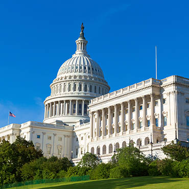 Shutterstock image (by holbox): Capitol building on a sunlit day.