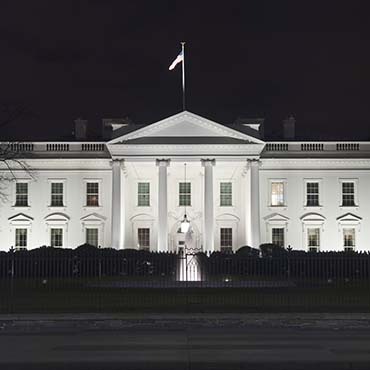 Shutterstock image: black and white image of the White House at night.