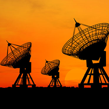 Shutterstock image (by TebNad): Satellite dishes over sunset.